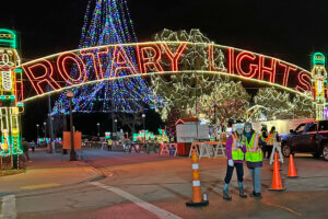 La Crosse Community Foundation CEO Jamie Schloegel volunteers at Rotary Lights with her daughter.