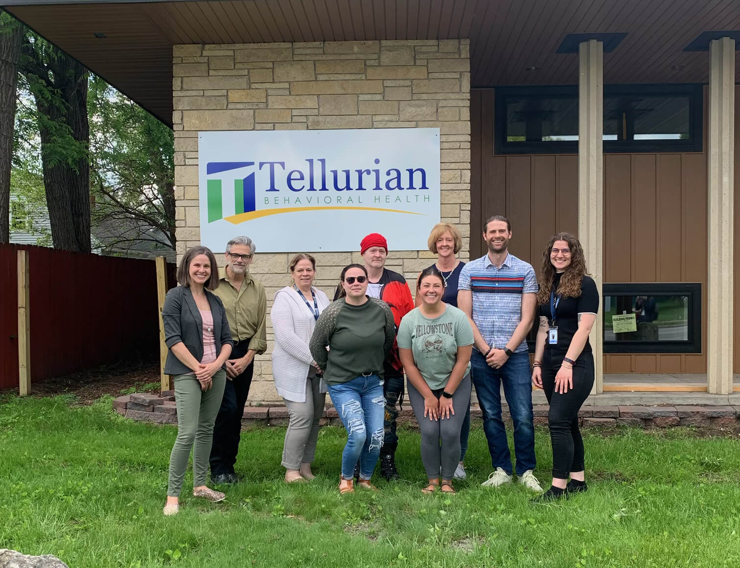 Tellurian Mental Health Crisis Stabilization Facility with Tellurian and La Crosse Community Foundation team members in front.