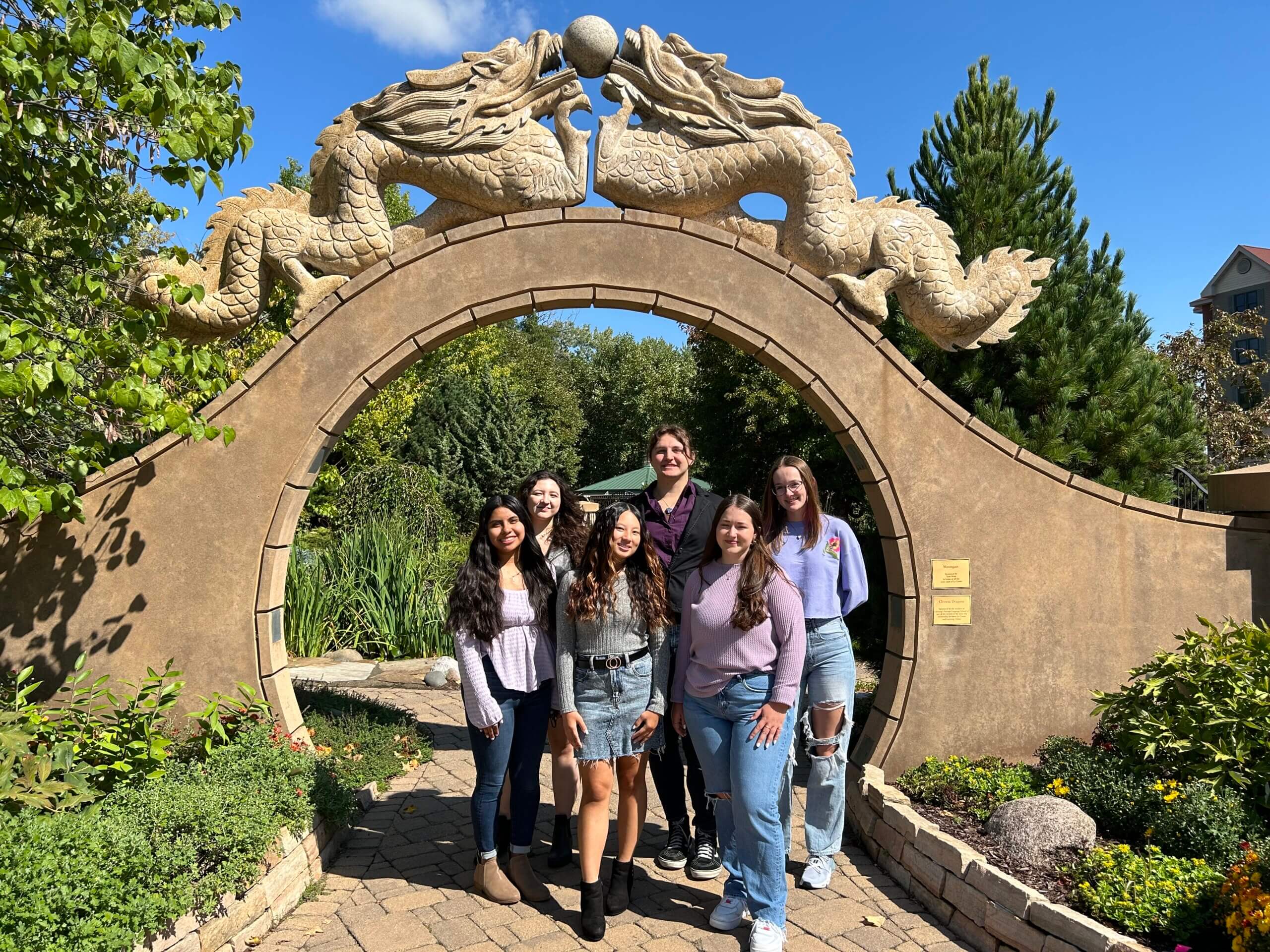 Women from ALANA pose for a photo at La Crosse's International Gardens.