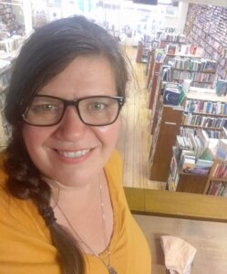 A favorite third space in La Crosse, Pearl Street Books serves as a backdrop for owner Beth Hartung.