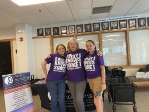 New Horizons Director of Programming and Personnel Heidi Svee and her colleagues at Domestic Violence Awareness Month event.